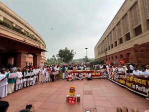 Opposition protests demanding a statement from Amit Shah in Parliament.